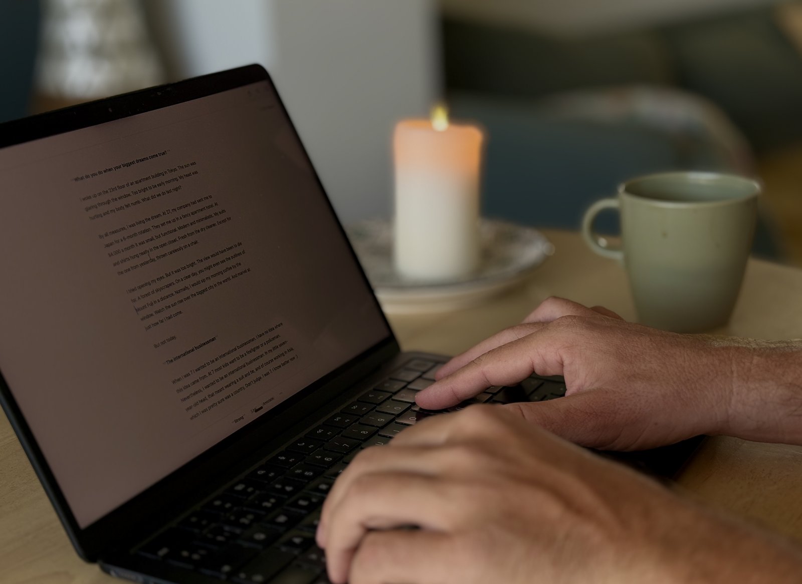 Ken Hellem writing at his table, working on his book The Art of Reinvention
